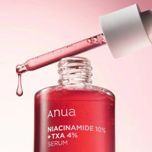 Anua niacinamide serum with dropper on a pink background