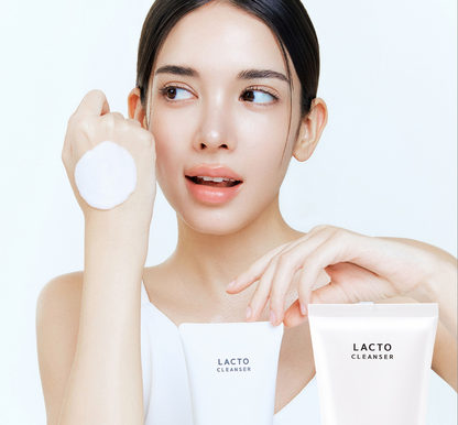 Woman holding LACTO CLEANSER packaging with a white background